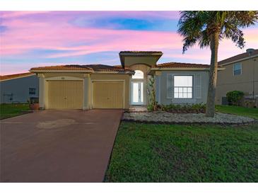 One-story house with two-car garage and landscaped lawn at 3151 Riachuelo Ln, Kissimmee, FL 34744