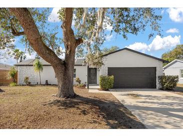 Updated home exterior boasts a modern design, fresh paint, and a landscaped yard at 1061 Lundy Ct, Winter Park, FL 32792