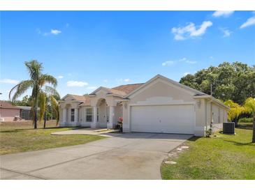 Charming single-story home with well-manicured lawn, neutral paint, and attached two-car garage at 3871 Dallas Blvd, Orlando, FL 32833