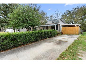 House exterior with driveway and hedges at 1103 Errol Place Cir, Apopka, FL 32712