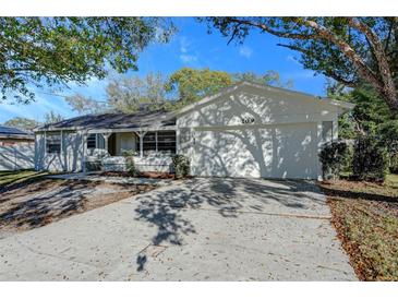 Updated single story home with a two car garage and a large driveway at 209 Meadow Hills Dr, Sanford, FL 32773