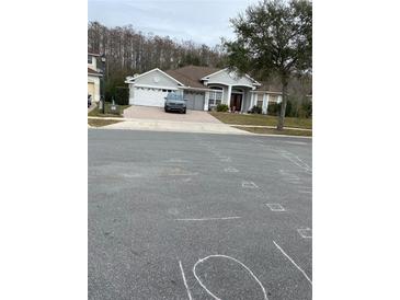 Two-story house with a two car garage and a spacious front yard at 3603 Kariba Ct, Kissimmee, FL 34746