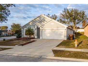 Single-Gathering home with two-car garage and driveway at 632 Kermarah Ave, Haines City, FL 33844