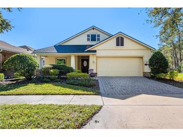 Beautiful one-story home with a two-car garage and well-manicured lawn at 1592 Lincolnshire Drive, Deland, FL 32724
