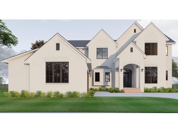 Stunning white brick home with modern black windows and a perfectly manicured lawn at 1112 Sarah Mathews Dr, Oakland, FL 34787