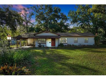 Charming ranch home with a spacious lawn and mature trees at 474 Overstreet Ave, Longwood, FL 32750