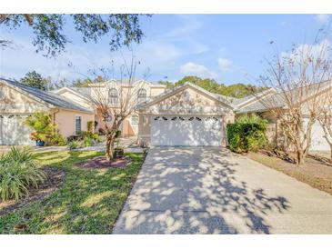 Two-story house with attached garage and well-manicured lawn at 1176 Athlone Way, Ormond Beach, FL 32174