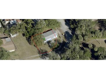 Aerial view showing a single-Gathering home on a tree-lined lot at 121 Valencia Dr, Edgewater, FL 32132