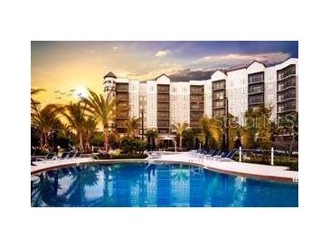 Resort-style pool and sundeck area with luxurious amenities at 14501 Grove Resort Ave # 3135, Winter Garden, FL 34787