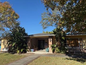 Ranch style home with mature landscaping and walkway at 1321 Maury Rd, Orlando, FL 32804