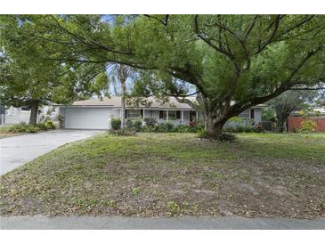 Ranch-style home with mature landscaping and a spacious yard at 3116 Oranole Rd, Orlando, FL 32810
