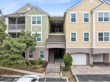 Two-story building with inviting exterior and landscaping at 3315 Parkchester Square Blvd # 102, Orlando, FL 32835