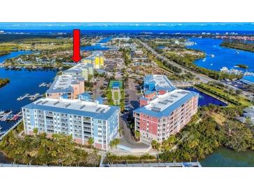 Aerial view of Riverwalk Condominiums at Coronado Island, showing building exteriors, landscaping, and waterfront location at 5 Riverwalk Dr # 503, New Smyrna Beach, FL 32169