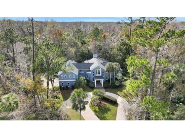 Luxury home nestled in wooded lot with circular driveway at 2229 Earleaf Ct, Longwood, FL 32779
