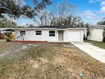 Newly renovated single story home with a landscaped yard at 1810 Selleen Dr, Eustis, FL 32726