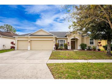 Attractive single-story home with two-car garage and landscaped lawn at 13442 Old Dock Rd, Orlando, FL 32828
