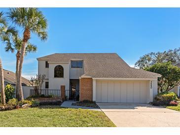 Attractive two-story home with a large garage and well-manicured lawn at 2660 Bent Hickory Cir, Longwood, FL 32779