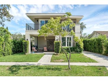 Modern two-story house with a landscaped lawn and walkway at 433 Carolina Ave, Winter Park, FL 32789