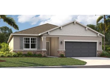 One-story home with gray siding, dark gray garage door, and landscaping at 1232 White Ash Loop, Deland, FL 32720