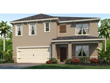 Two-story house with beige exterior, two-car garage, and landscaping at 1507 Aurora Ridge Dr, Zellwood, FL 32798