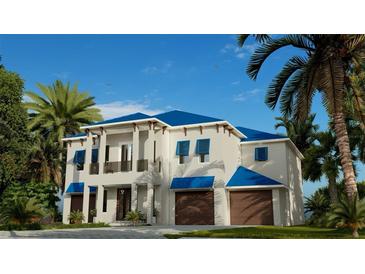 Two-story home with blue roof, two-car garage, and tropical landscaping at 749 S Atlantic S Ave, Ormond Beach, FL 32176