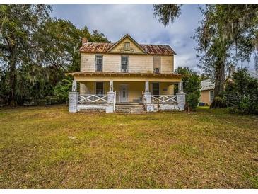 Two-story home with front porch and large yard at 750 E Pearl St, Bartow, FL 33830