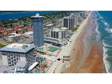 Stunning aerial view of the property with beach access, nearby hotels and beautiful coastline at 2626 S Atlantic Ave # 102, Daytona Beach Shores, FL 32118