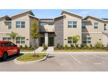 Two story townhome with modern facade and landscaping at 2600 Reading Trl, Kissimmee, FL 34746