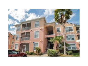 Two-story condo building with inviting entryway and landscaping at 13536 Turtle Marsh Loop # 538, Orlando, FL 32837