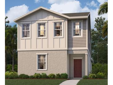 Two-story house with light beige exterior, red door and landscaping at 360 Belmond Dr, Debary, FL 32713