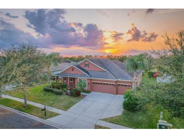 Attractive single-Gathering home with a two-car garage and lush landscaping at 169 Magneta Loop, Auburndale, FL 33823