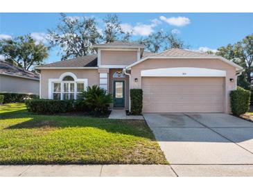 One-story house with a two-car garage and manicured lawn at 389 Mohave Terrace, Lake Mary, FL 32746