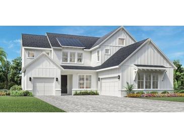 Two-story modern farmhouse with white siding, gray roof, and a two-car garage at 1418 Pinecliff Dr, Apopka, FL 32703