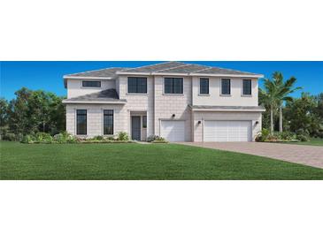 Two-story home with light-colored brick exterior, three-car garage, and manicured lawn at 17406 Pesce Loop, Montverde, FL 34756