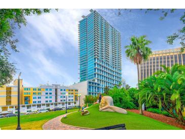 High-rise building with city views and lush green space at 150 E Robinson St # 1410, Orlando, FL 32801