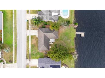 Aerial view of the home and grounds showing the lake front and private dock at 116 Sheridan Ave, Longwood, FL 32750