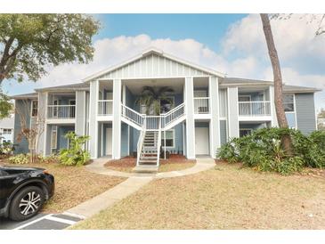 Two-story building exterior with stairs and landscaping at 2580 Grassy Point Dr # 102, Lake Mary, FL 32746