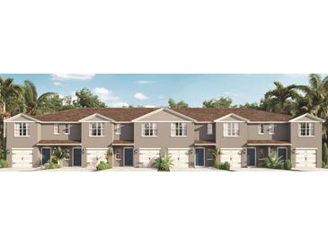 Modern townhome community with attached garages and neutral color palettes at 2909 Hudson Hammock Way, Saint Cloud, FL 34773