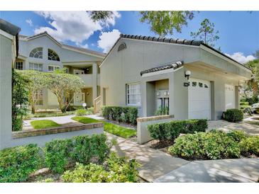 Attractive exterior of a two-story condo with landscaping and a two-car garage at 3992 Radley Ct, Longwood, FL 32779