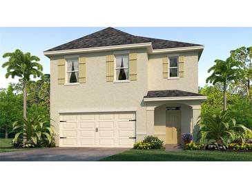 Two-story house with a neutral color scheme and a two-car garage at 7073 Carib Grackle Dr, St Cloud, FL 34773