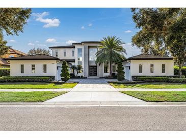 Stunning two-story home with modern design and landscaping at 11618 Vinci Dr, Windermere, FL 34786