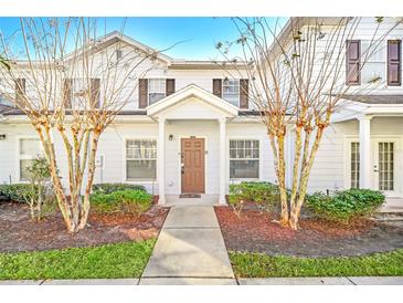Inviting exterior of a two-story home with landscaping and walkway at 2956 Lucayan Harbour Cir # 107, Kissimmee, FL 34746