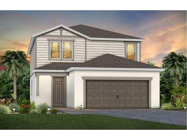 Two-story home with gray siding, brown garage door, and landscaping at 2440 Belle Haven Way, Davenport, FL 33896