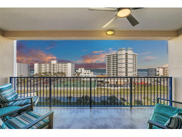 Stunning balcony view overlooking ocean and cityscape at sunset at 5300 S Atlantic Ave # 604, New Smyrna Beach, FL 32169