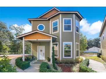 Two-story craftsman style home with covered porch and landscaping at 543 Sunbranch Ln, Casselberry, FL 32707