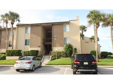 Two-story condo building with parking and landscaping at 596 Orange Dr # 151, Altamonte Springs, FL 32701