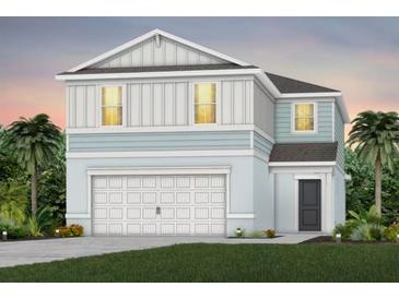 Two-story house with light blue and white siding, white garage door, and landscaping at 2436 Belle Haven Way, Davenport, FL 33896