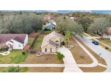 Attractive single-Gathering home with a spacious driveway and well-manicured lawn at 905 Hatteras Ave, Minneola, FL 34715