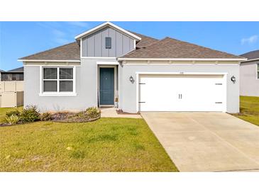 Curb appeal abounds in this charming one-story home, featuring a two-car garage at 776 Rioja Dr, Minneola, FL 34715