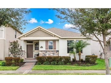 Charming one-story home with stone accents and landscaped yard at 10248 Sand Cay Dr, Winter Garden, FL 34787